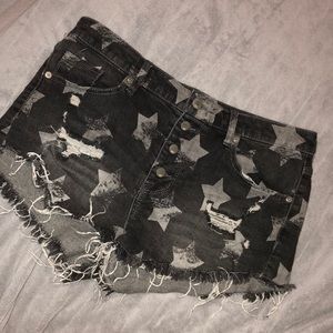 High rise distressed button-up shorts.